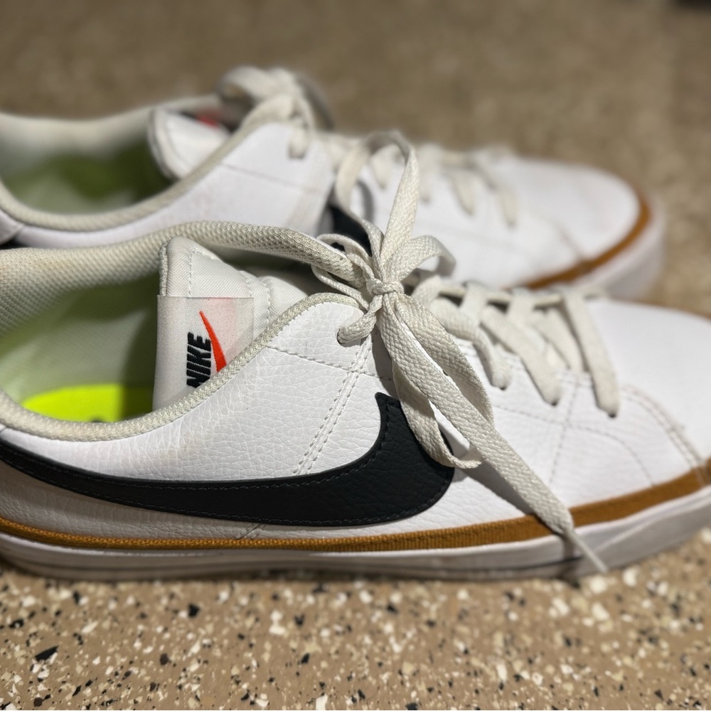 Nike White and Black Sneakers with Gold Trim